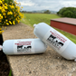 Two packages of Sonoma Mountain Beef Co. on a stone surface with a scenic background.